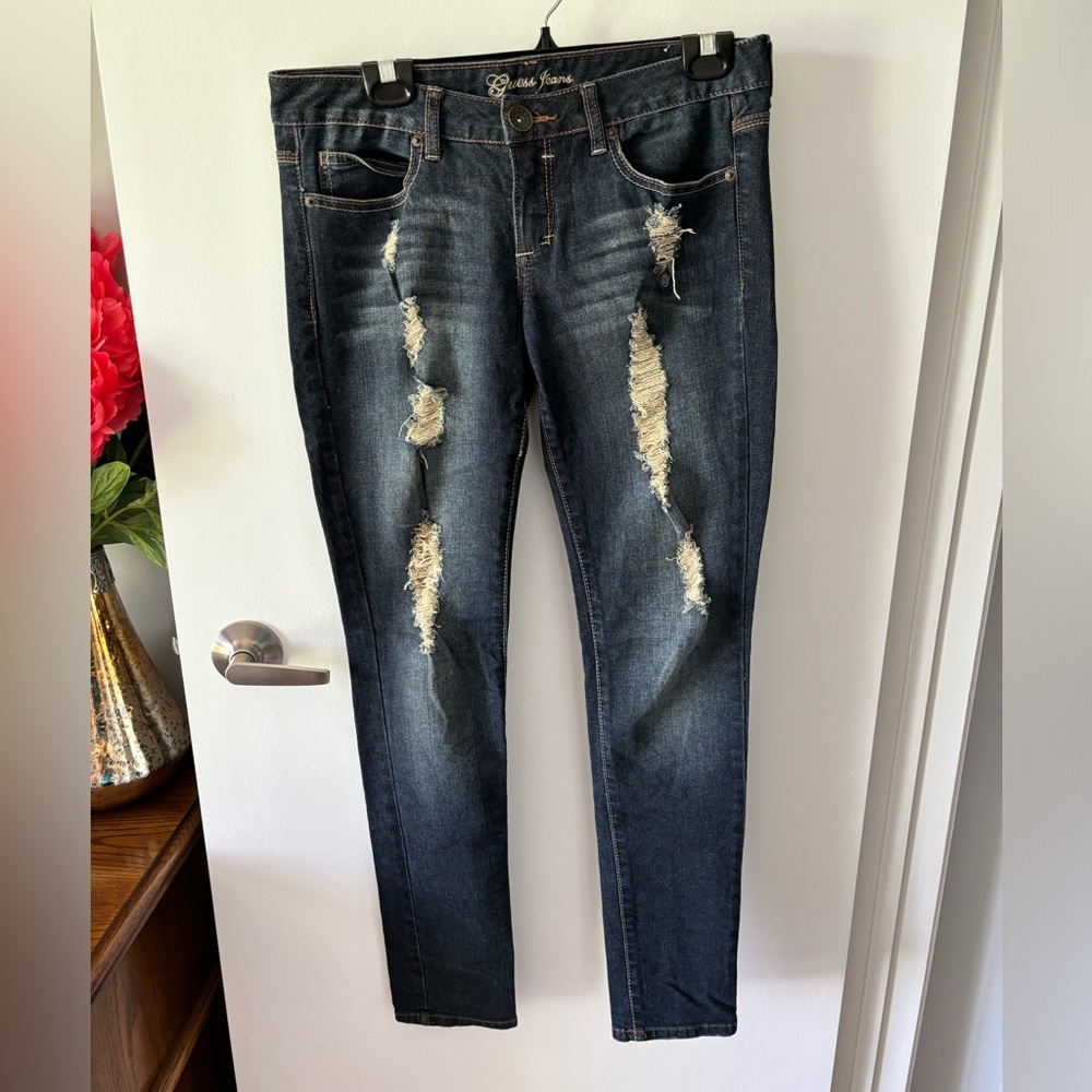 Dark distressed denim jeans